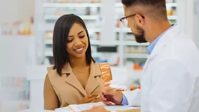 pharmacist helping customer