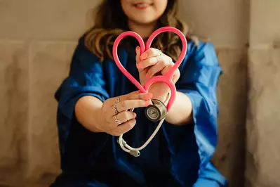 doctor with a stethoscope in the shape of a heart