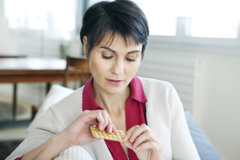 woman taking hormone therapy