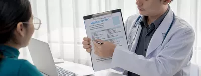 patient reviewing medical record with doctor