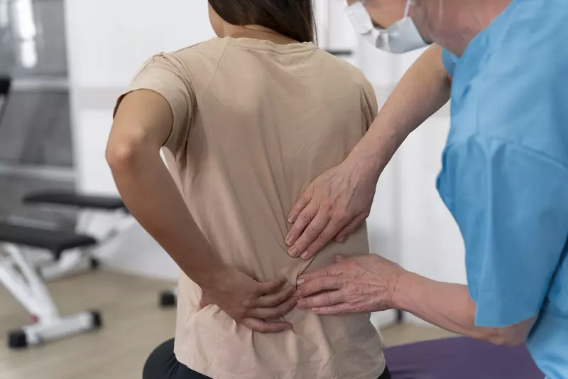 medical assistant helping patient 