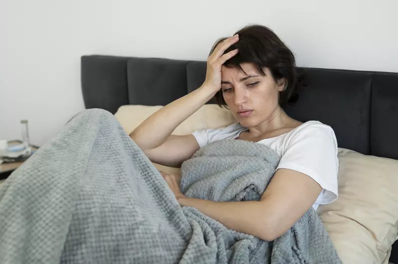 woman in bed sick